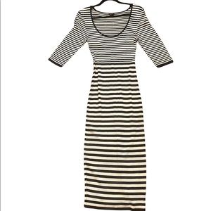 One dress is a white and black striped the other is a black and gray animal prin